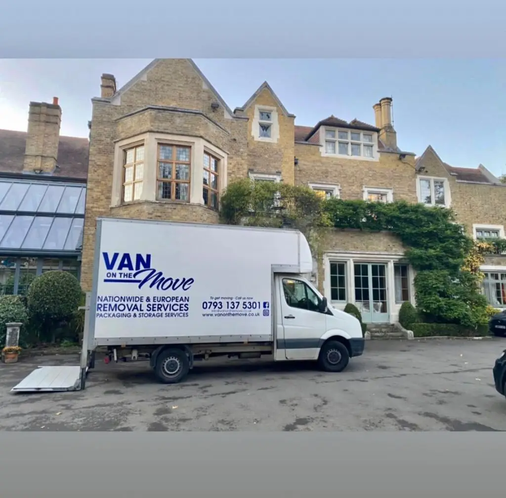 A VAN on the MOVE Luton van, in the company’s livery, parked outside a period house